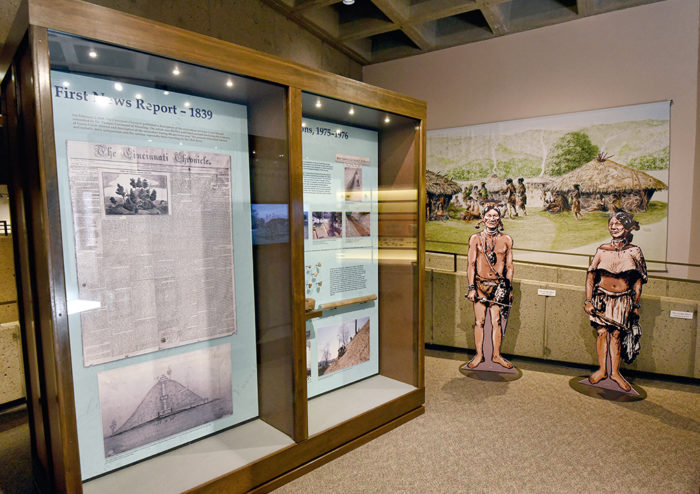 Grave Creek Archaeological Complex Upper Gallery exhibit area. Shows First New Report 1839 and Native American life exhibit.